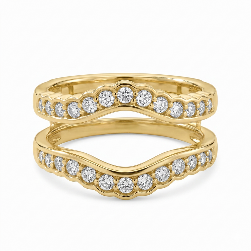 This yellow gold ring guard features two diamond-lined bands totaling 5/8 carat total weight, with scalloped curves designed to frame an engagement ring. The open center and flowing silhouette add beautiful brilliance and dimension while also making a striking stackable style.
