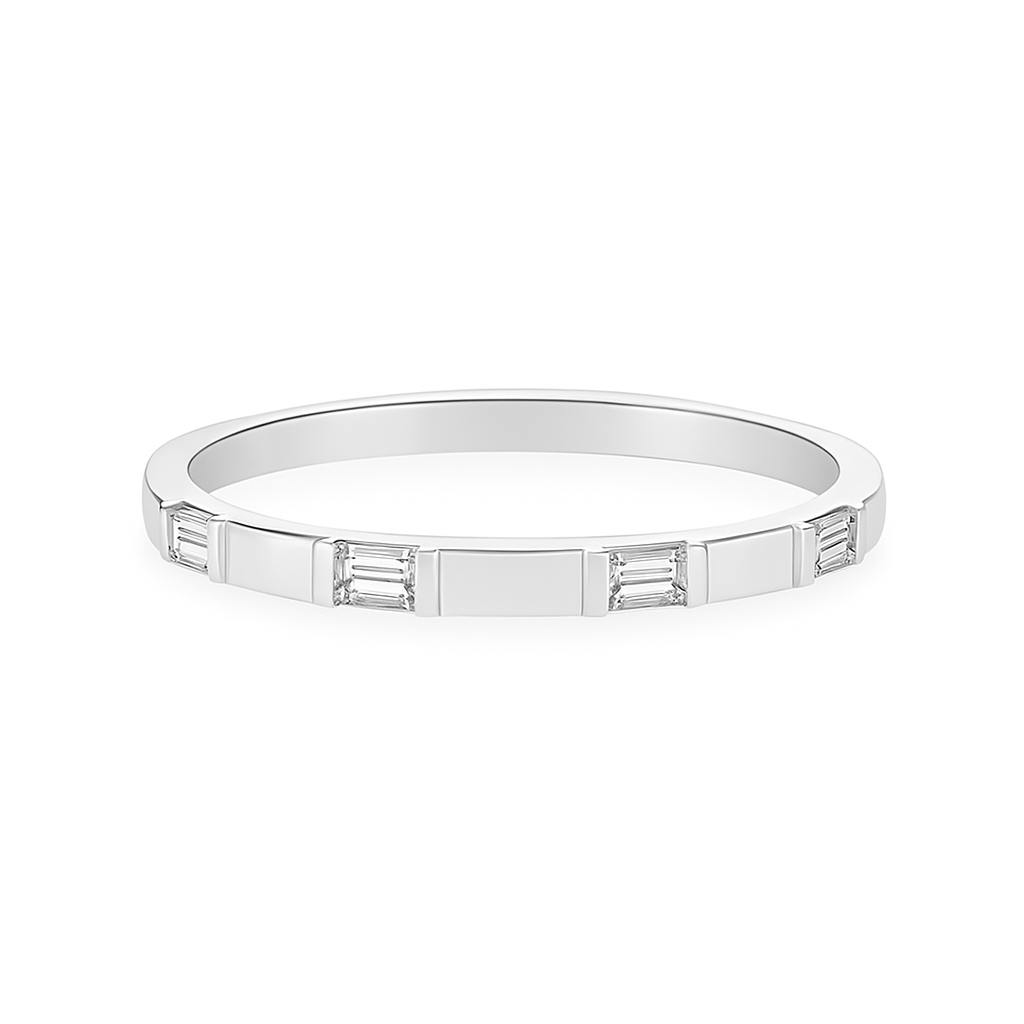 A graceful stream of diamonds flows in perfect balance across 14K white gold, totaling 1/8 carat in weight. Designed with modern elegance, it layers effortlessly or shines with quiet brilliance on its own.