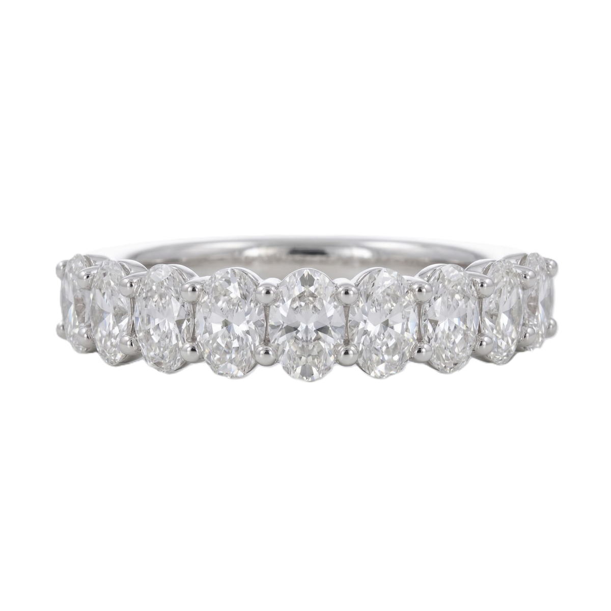 This refined diamond band, designed with a continuous row of oval-cut diamonds. Each stone is set to sit closely together, creating a smooth, flowing line across the band. Crafted in 14K white gold with 1 carat total weight, the design feels open, balanced, and quietly striking.