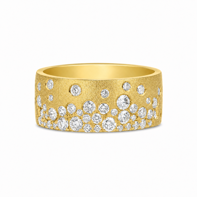 Crafted to capture the beauty of a star-filled sky, this 14K yellow gold cigar band showcases 1 carat total weight of flush-set diamonds scattered across a rich satin finish. The smooth, contemporary profile and organic arrangement of diamonds create a striking balance of texture and brilliance.