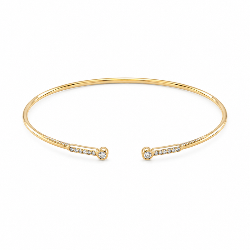 A playful mix of diamond dots and slender pavé-set bars gives this 14K yellow gold bangle its distinctive look. With 1/10 carat total weight of diamonds, the open flex design brings a delicate sparkle that looks beautiful worn alone or layered.