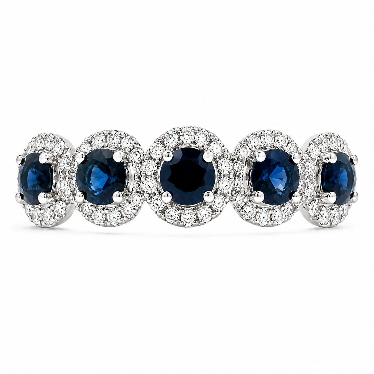 Five deep blue genuine sapphires are each framed by sparkling diamond halos in this 14K white gold ring. The repeating halo design creates a striking sweep of rich color and brilliance across the finger.
