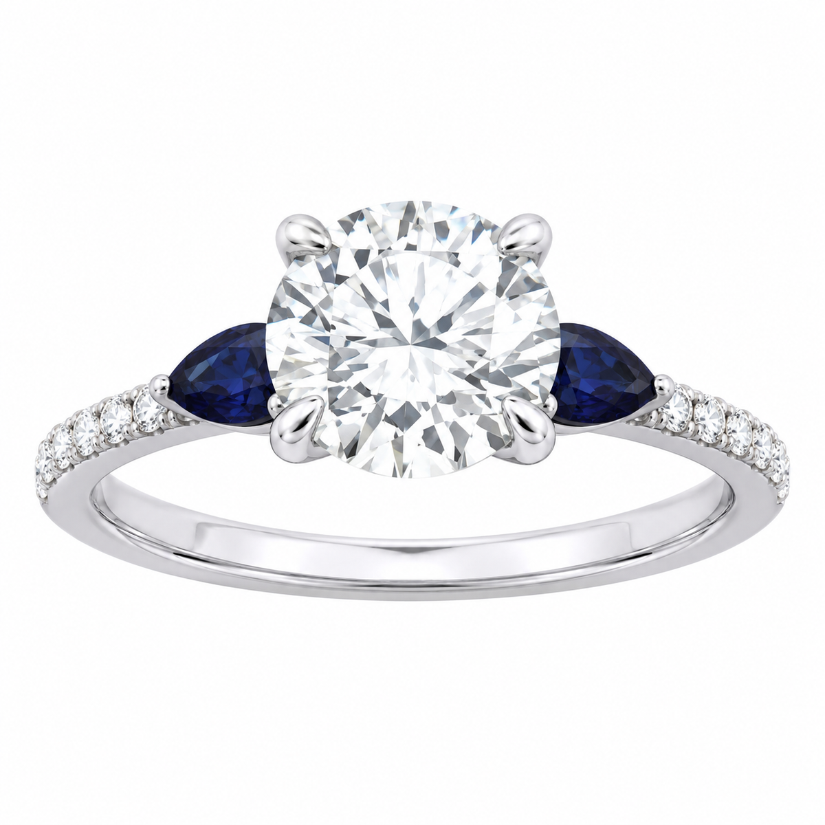 A white gold or platinum engagement ring featuring a round-cut center diamond, flanked by two marquise-cut deep blue sapphires and a pavé band of small clear diamonds on a white background.