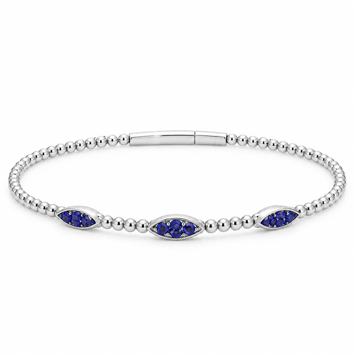 A silver beaded bracelet featuring three marquise-cut blue gemstones in the center, displayed on a clean white background.