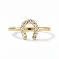 A classic horseshoe silhouette is traced with shimmering diamonds, creating a symbol of luck with a refined golden glow. Crafted in 10K yellow gold with 1/10 carat total weight of diamonds, this ring brings a touch of sparkle and everyday charm to a meaningful design.