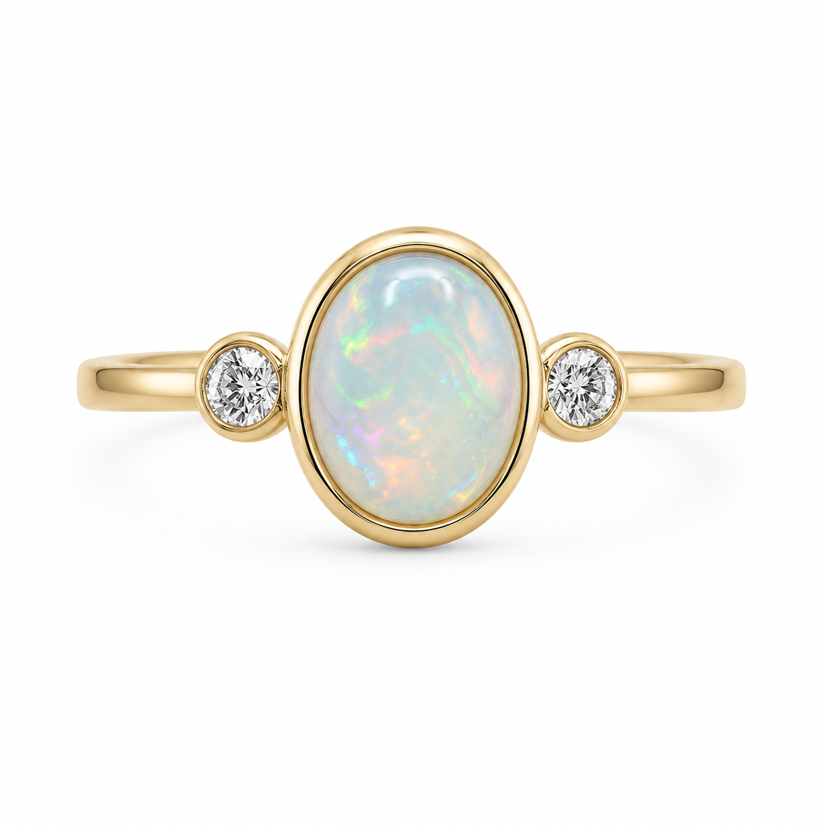 A dream of color and light, this three-stone ring showcases a radiant 1 CT genuine oval opal framed in a 14K yellow gold bezel setting. Flanked by two bezel-set round brilliant diamonds totaling 1/6 CTW, its fiery, shifting hues dance across a clean, polished band for a modern statement full of ethereal charm.