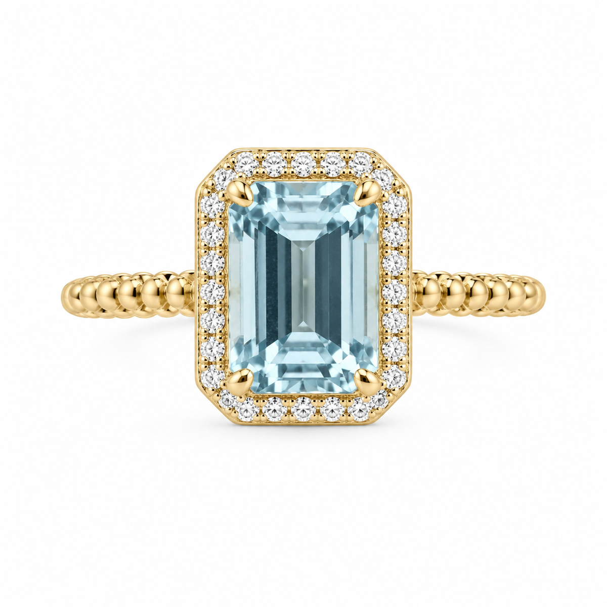 Inspired by crystal-clear ocean waters, this statement ring highlights a 1 1/2 CTW emerald-cut genuine aquamarine encased in a halo of round brilliant diamonds. Crafted in 14K yellow gold with a textured twisted-rope band, it pairs 1/15 CTW of diamond sparkle with cool aquatic blue.