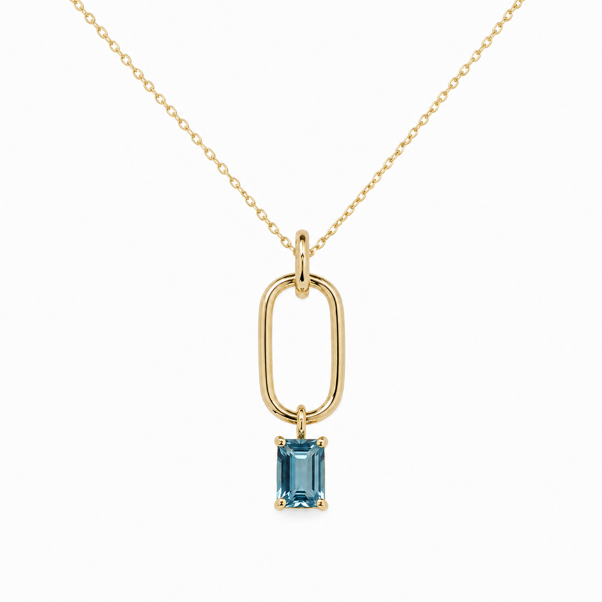 Blending modern chic with serene color, this necklace features a crisp 6x4mm emerald-cut blue topaz suspended from a sleek 14K yellow gold paperclip link. Crafted with a polished finish and delicate chain, it brings effortless contemporary style and a refreshingly clear pop of blue to any stack or neckline.