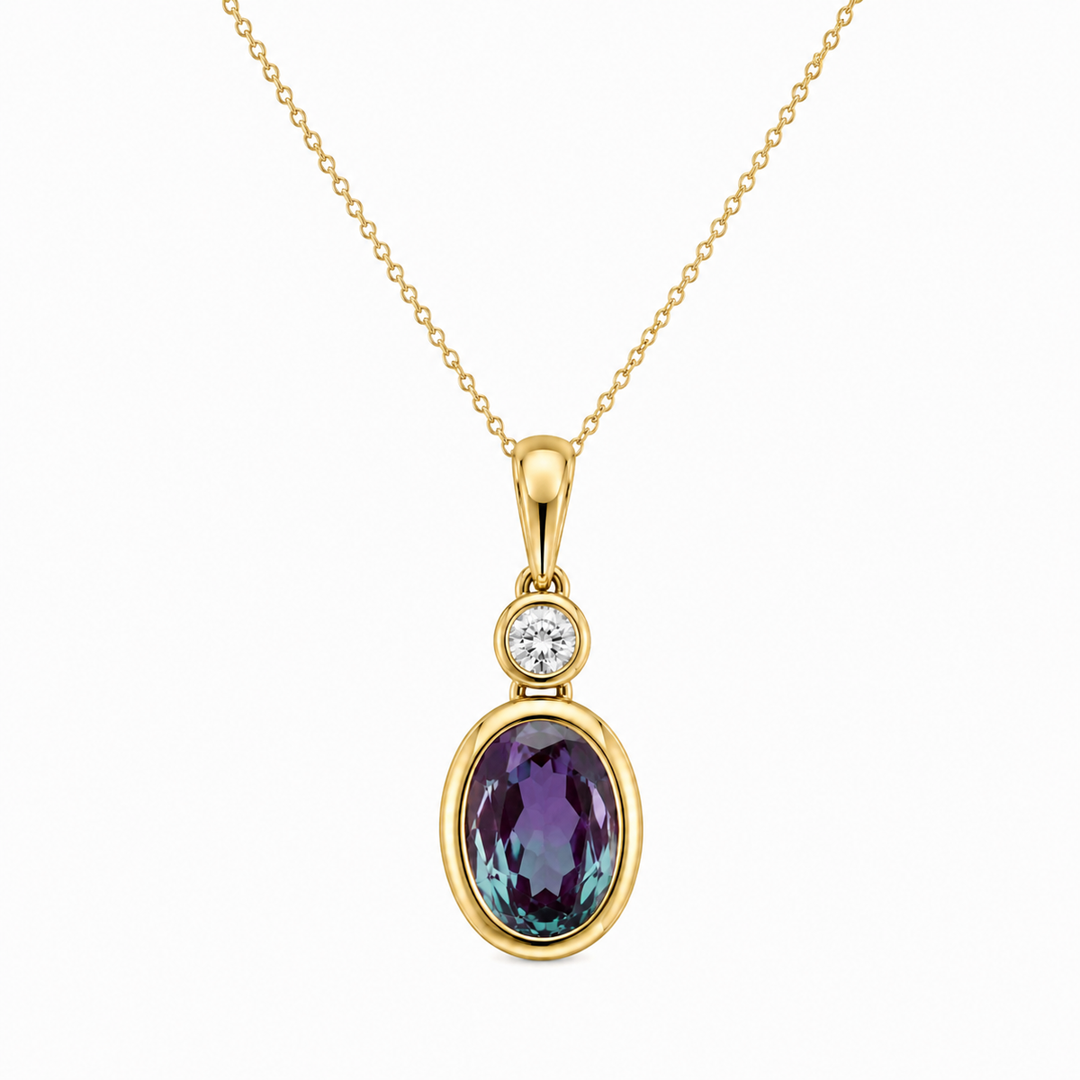 Featuring captivating color-shifting depth, this pendant centers an 8x6mm oval lab-created alexandrite framed in a smooth 14K yellow gold bezel. Topped with a brilliant bezel-set diamond with 1/10 CTW, it offers a sleek, modern profile with irresistible magic.