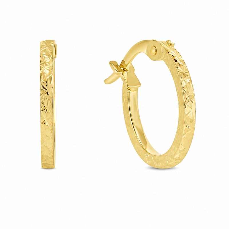 A pair of gold hoop earrings with a textured, diamond-cut pattern on the outer surface, shown on a plain white background. One earring is shown from a side profile view, and the other is shown from a three-quarter angle displaying the hinge clasp.