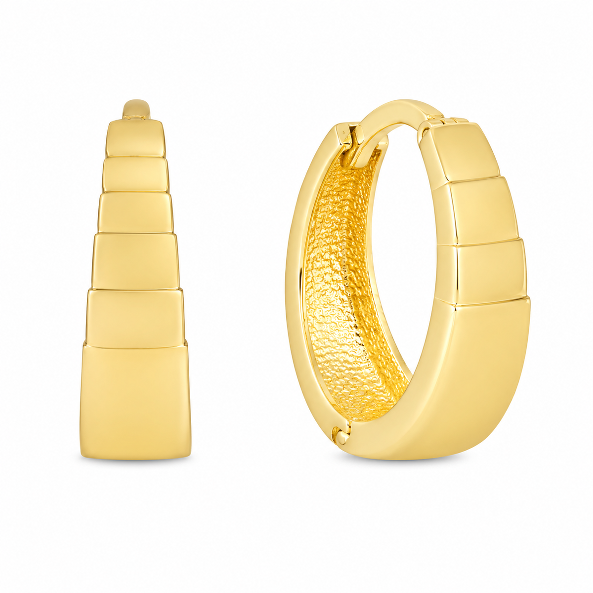 A pair of gold huggie hoop earrings shown on a plain white background, with one earring facing forward to show the stacked rectangular exterior and the other angled to show the textured gold interior.