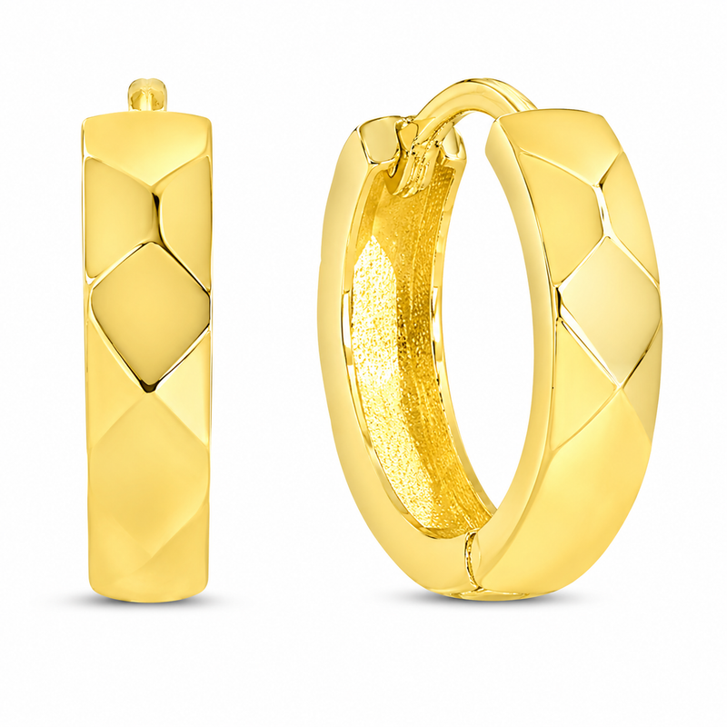 A pair of gold huggie hoop earrings with a textured, diamond-patterned exterior and a polished interior, shown on a clean white background.