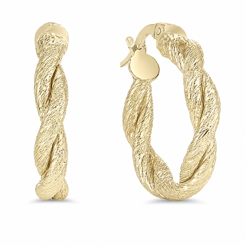 A finely textured twist gives these 10K yellow gold hoop earrings the look of woven strands, creating dimension and shimmer from every angle. Their softly rounded silhouette and hinged closure make them an eye-catching addition to both everyday and dressy looks.

Measures 4MM, 20.60, 23MM