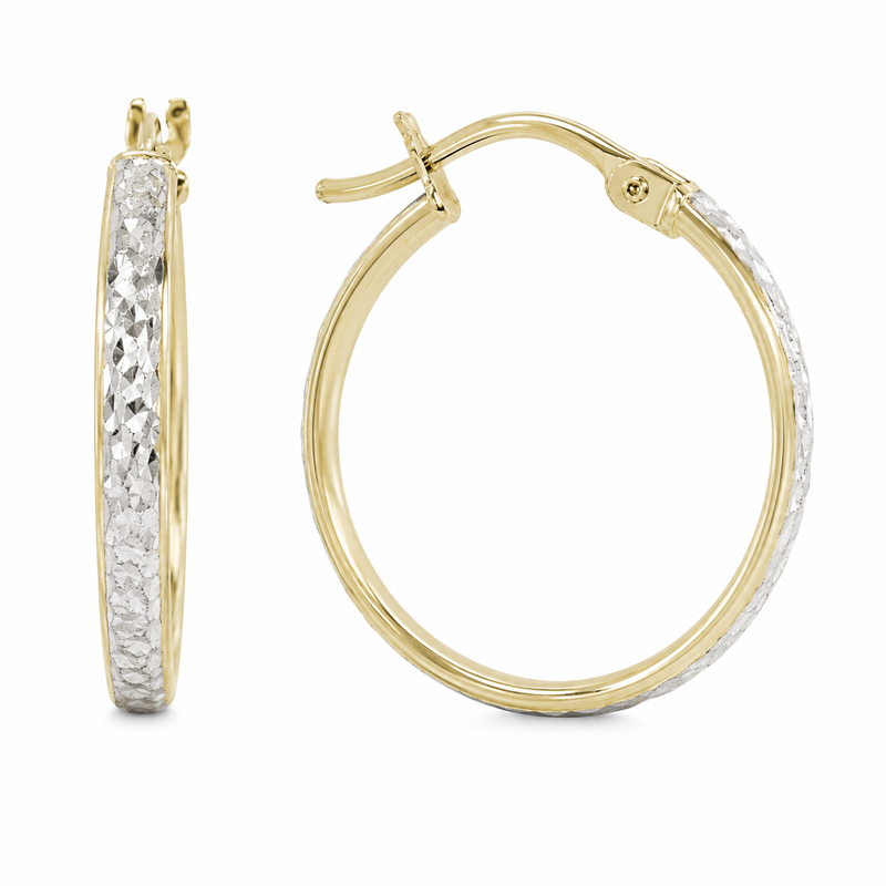 These hoops pair polished 10K yellow gold with a diamond-cut white gold accent that catches and reflects the light with every movement. The slim profile and contrasting finishes give this classic silhouette an elegant touch of shimmer.

Measures 18.55MM, 18MM, 1.9MM
