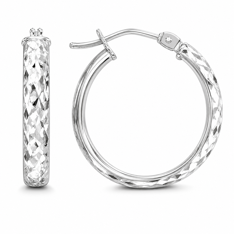 A full diamond-cut finish gives these 10k white gold hoops exceptional sparkle, creating a faceted surface that catches and reflects light from every angle. Their rounded silhouette and hinged closure offer timeless style with an elevated, shimmering finish.

Measures 3.65MM, 14.3, 18.15MM.