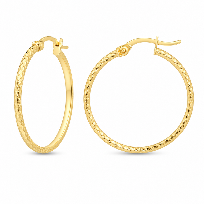 A diamond-cut finish gives these classic 10K yellow gold hoops a light-catching shimmer from every angle. Their slim, rounded profile and hinged design make them an effortless everyday staple with added brilliance.

Measures 1.44MM, 17.8, 19.13MM.